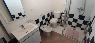 a bathroom with a toilet and a sink and a shower at Sal Service new studio penthouse in Santa Maria