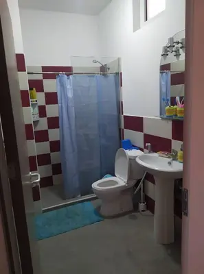 a bathroom with a toilet and a sink at Apartamento T2 em Sal Rei - Boavista in Sal Rei