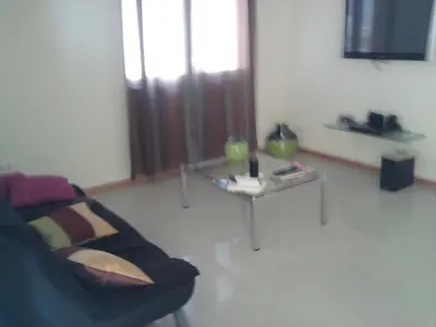 a living room with a couch and a table at Apartamentos Santiago - Maio in Vila do Maio