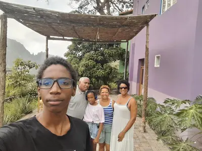 a group of people standing in front of a house at Pousada Rural Simpatia in Caculi