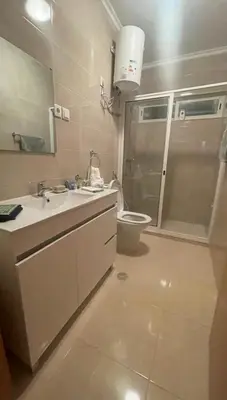 a bathroom with a sink and a toilet at Lovely - Luxury 2 Bedrooms 500m from the Beach in Santa Maria