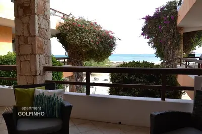 a balcony with a view of the ocean at BookingBoavista - Apartments in Sal Rei