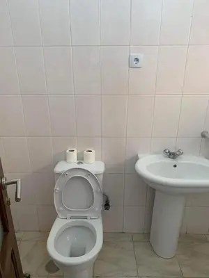 a bathroom with a toilet and a sink at Appart Hotel Belvedere in Praia