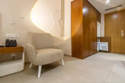 a living room with a chair and a desk at Luna Boutique Hotel in Mindelo