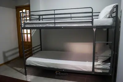 a couple of bunk beds in a room at Helton´s Residence in Praia