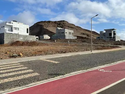 a road with a street light on the side of a building at Kyaala Suítes - pool & sea view in Praia