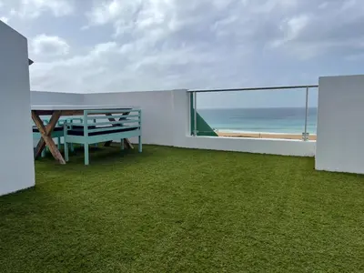 a balcony with a table and a view of the ocean at New Rooftop Gem with stunning Oceanview in Santa Maria