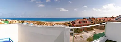 a view of the beach from the balcony of a house at New Rooftop Gem with stunning Oceanview in Santa Maria