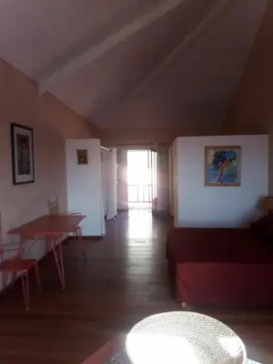 a living room with a couch and a table at Casa Azul in Mindelo