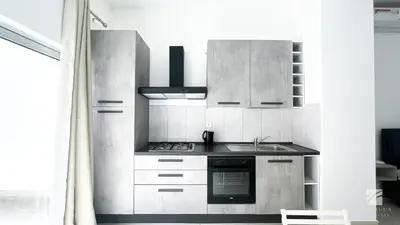 a kitchen with a sink and a stove top oven at Ka Djula in Sal Rei