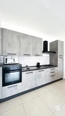 a kitchen with stainless steel cabinets and a stove at Ka Djula in Sal Rei