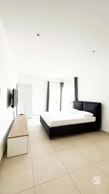a white room with a bed and a table at Ka Djula in Sal Rei