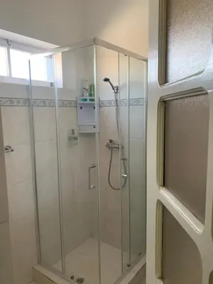 a shower with a glass door in a bathroom at CA FILO in Espargos