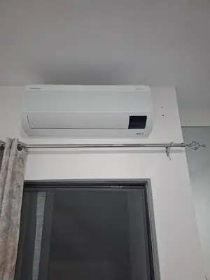 a tv on the ceiling of a room at Figo Apartamentos Cidadela Comfort Flats in Praia