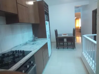 a kitchen with a stove and a counter top at Repousando in Mão para Trás