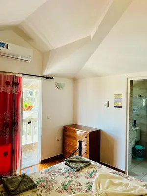a bedroom with a bed and a dresser and a window at Casa BB&Djassi - ROOMS in Ponta do Sol