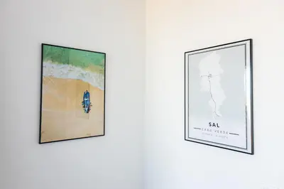 three framed artworks on a wall at 3 bdr aprt, stunning seaview, rooftop pool - LCGR in Praia
