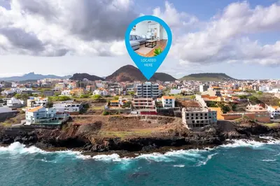 a view of a city from the ocean with a blue marker at 3 bdr aprt, stunning seaview, rooftop pool - LCGR in Praia