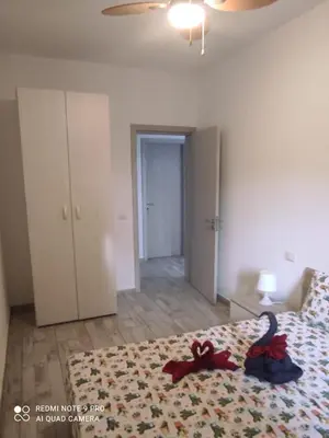 a bedroom with a bed with a red ribbon on it at Casa Veronica Boavista in Sal Rei