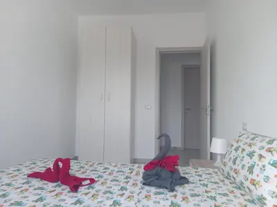 a bedroom with two slippers on a bed at Casa Veronica Boavista in Sal Rei