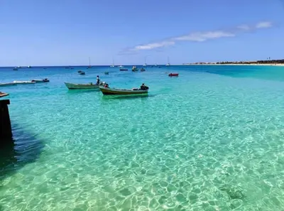 two boats in the water in the ocean at Beach front ocean view Porto Antigo2 Santa Maria in Santa Maria