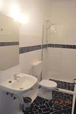 a bathroom with a sink and a toilet and a shower at LA VELA in Palmeira
