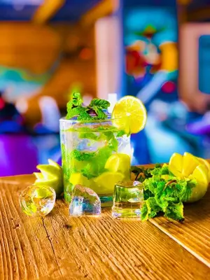 a glass jar of lemonade with lemon slices andilantro at Oasis White Hotel in Sal Rei