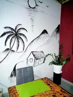 a dining room with a palm tree mural on a wall at Casa Familiar Pôr do Sol in Ribeira Grande