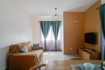 a living room with a couch and a television at Nifa House in Espargos