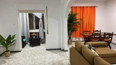 a living room with a couch and a table at Lovely Apartment In Mindelo City Center in Mindelo