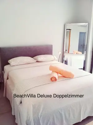 a bedroom with a bed with a towel on it at Luxury Beach Villa, Praia de Chaves, Boa Vista in Boa Ventura