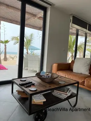 a living room with a coffee table and a couch at Luxury Beach Villa, Praia de Chaves, Boa Vista in Boa Ventura