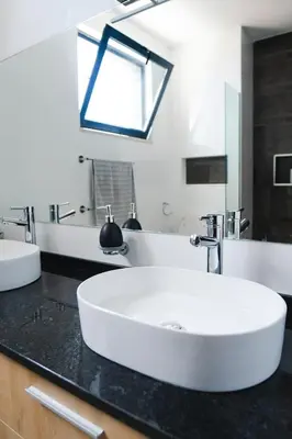 a bathroom with a white sink and a mirror at 3 bdr aprt, amazing seaview, rooftop pool - LCGR in Praia