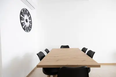 a conference room with a wooden table and chairs at 3 bdr aprt, amazing seaview, rooftop pool - LCGR in Praia
