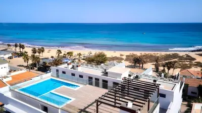 an aerial view of a resort with a beach at SunSet in Santa Maria