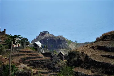 a group of houses on a hill near the ocean at Pousada Dragoeiro Monte Joana Santo Antão in Ribeira Grande