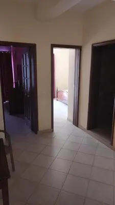 a room with two doors and a tiled floor at Casa de Gá in Mindelo