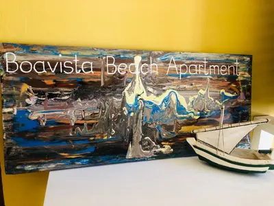 a picture of a wooden boat on a table at Boavista Beach Apartment in Sal Rei