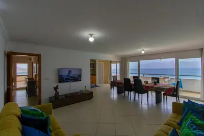 a living room with a view of the ocean at Sky Mariposa sospesa sul mare in Mindelo