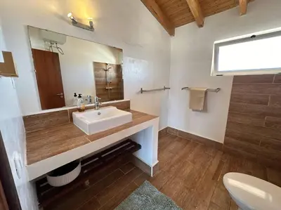 a bathroom with a sink and a mirror at Spacious Penthouse with Sea View - Boteto U in Sal Rei