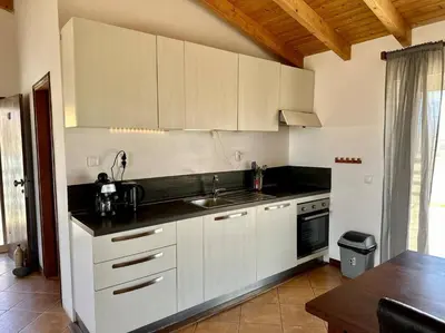 a kitchen with white cabinets and a sink at Spacious Penthouse with Sea View - Boteto U in Sal Rei