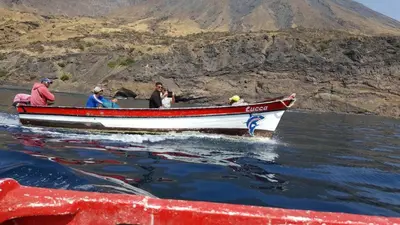 a group of people in a boat in the water at Pousada Cantinho de Preta in Seladinha