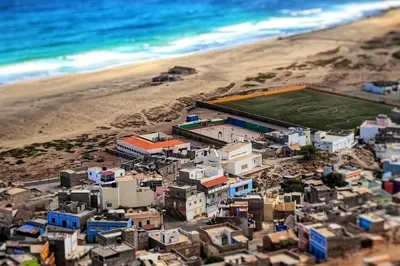 an aerial view of a beach with a soccer field at Beach house kasa Sala mansa in Salamansa