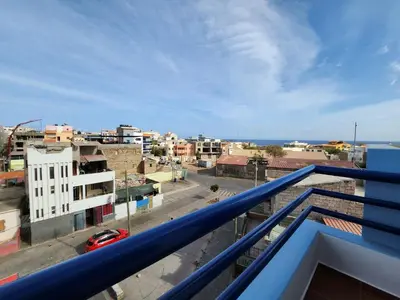 a view of a city from a balcony at Txada Hostel in Praia