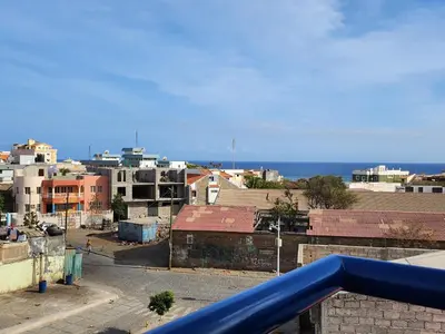 a view of a city from a balcony at Txada Hostel in Praia