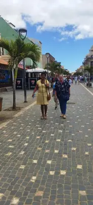 two people walking down a cobblestone street at SOL AZUL in Santa Maria