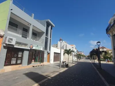 an empty street in a city with buildings at Apartamento Mágico p/ momentos Memoráveis in Santa Maria
