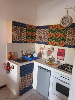 a small kitchen with a sink and a stove at Appartamento Alma de Cri 10b, Sal Rei Estoril in Sal Rei