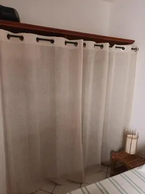a white shower curtain in a bedroom at Appartamento Alma de Cri 10b, Sal Rei Estoril in Sal Rei