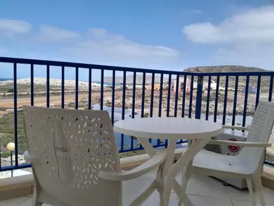 a table and chairs on a balcony with a view at Solaren Apartments Boavista in Sal Rei